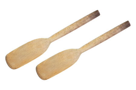 Two old cooking wood paddles isolated on white.の写真素材