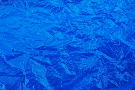 blue wrinkled plastic texture background.の写真素材