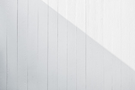 white wood background with shade and sunlight.