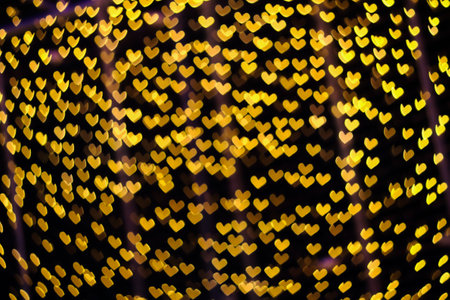yellow neon blur heart shape light from camera lens for pattern and background.の写真素材