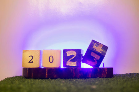 Wooden blocks with numbers 2021 on green grass. Happy new year concept.の写真素材