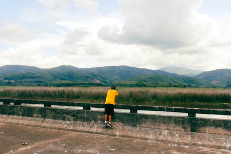 young fitness woman runner running at seaside mountain trail, healthy lifestyleの写真素材