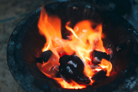 Burning coals in the furnace, close-up, selective focusの写真素材