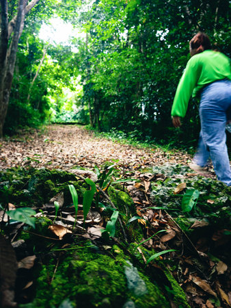 Man walking in the forest. Traveling in tropical forest. Nature background