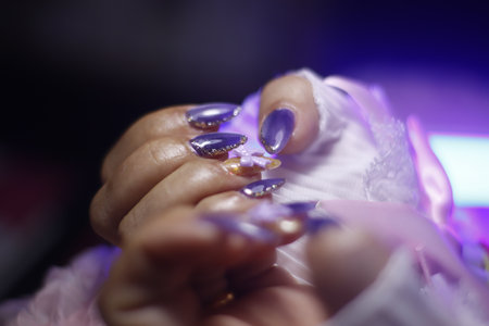 Female hands with beautiful manicure. Manicure in the salon.の写真素材