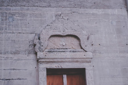 Thai style stucco on the wall of the temple.