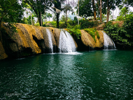 Tropical waterfall in the jungle of Bali island, Indonesiaの写真素材