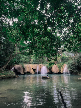 Tropical waterfall in rainforest, Thailand. Vintage tone.の写真素材