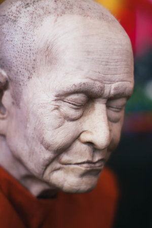 Statue of a monk in a Buddhist templeの写真素材