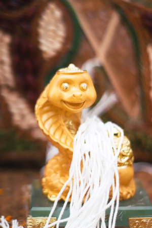 Golden statue with white string.の写真素材