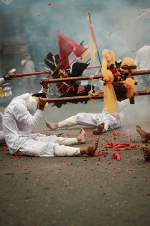 Hindu devotees perform a religious ritual during Thaipusam festival.