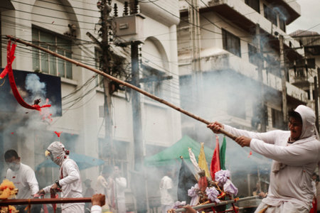 View of unknowns people attending a religious ceremony at the Pashupatinath temple in the morningの写真素材
