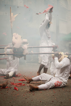 Hindu devotees perform a ritual on the banks of the Ganges.の写真素材