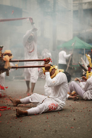 Hindu devotees perform a religious ritual at Thaipusam festival in Kolkata, West Bengal, India.の写真素材