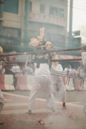 Devotees perform religious rituals during the Holi festival.の写真素材