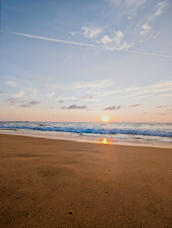 beautiful sunset on the beach, blue sky with clouds and seaの写真素材