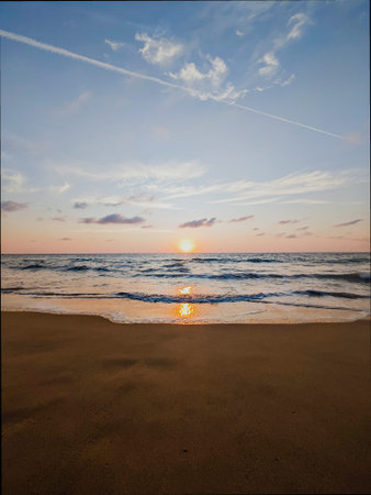 Sunset on the beach. Beautiful sunset on the sea. Beautiful sky.の写真素材