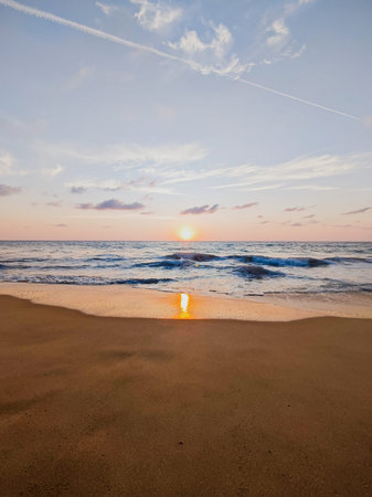 beautiful sunset on the beach, summer landscape, sea and skyの写真素材