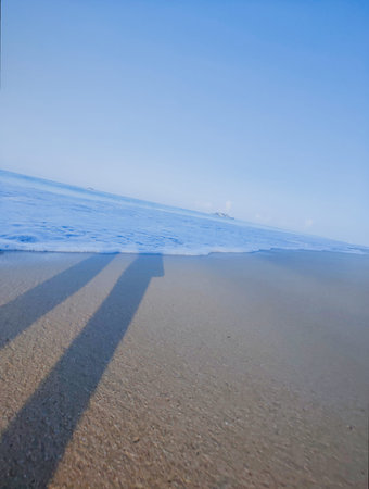 sandy beach and blue sky in winter, closeup of photoの写真素材