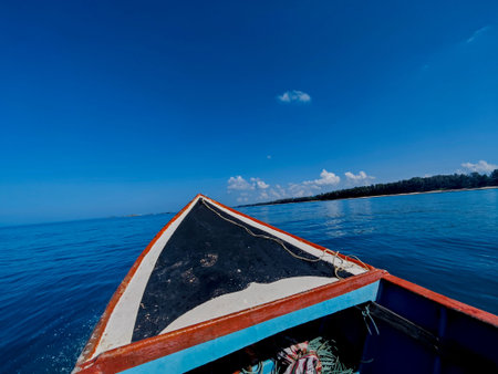 Boat in the sea with blue sky and white clouds background.の写真素材