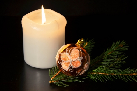 Christmas decoration with twig of spruce on the blackの写真素材