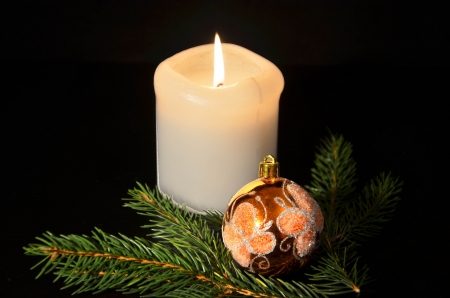 Christmas decoration with twig of spruce on the blackの写真素材