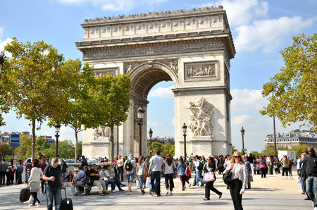 PARIS / FRANCE - September 23, 2011: Many people at the western end of the Avenue des Champs-Elysees with very famous monument "The Arc de Triomphe" in backgroundのeditorial素材