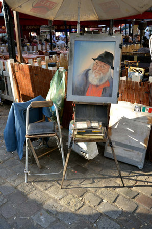 PARIS / FRANCE - September 24, 2011: Picture of old man with glasses and black hat on display in Montmartre. Montmartre in Paris is place, where many notable artists lived and worked.のeditorial素材