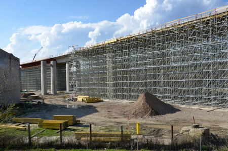 Highway building process: building of carriageway over land on pillars