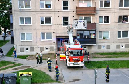 Bytca, Slovakia - June 4, 2016: Firefighters at beginning of action stand with two police officers...