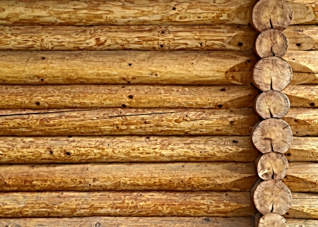 background or texture of a wooden log cabin wallの写真素材