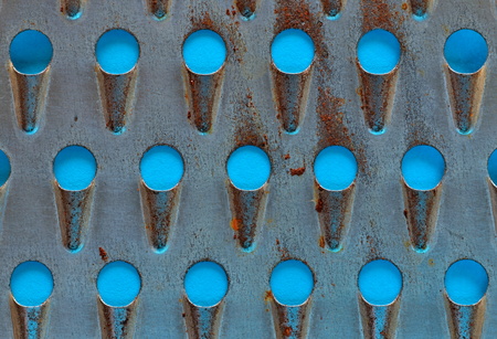 Abstract background of old perforated metal graterの写真素材