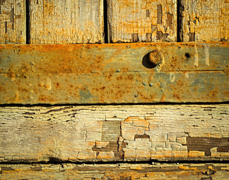background Old paint on wooden boards with strip steelの写真素材