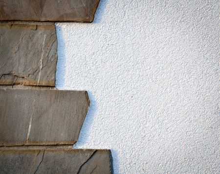 background or texture stone cladding on white wallの写真素材