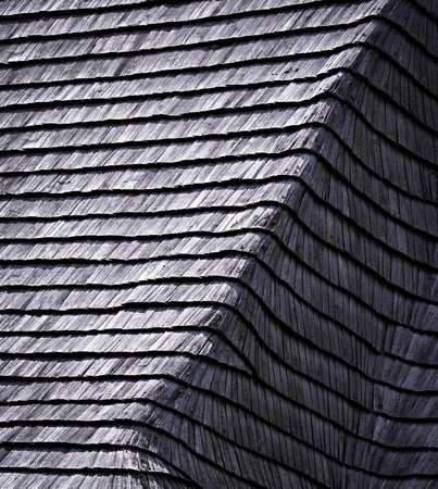 background or texture old damaged wooden shingle roofの写真素材