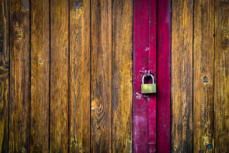abstract background or texture locked wooden doorの写真素材