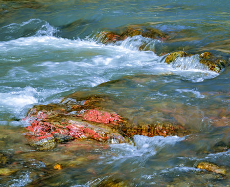 abstract background or nature scene red stone in a wild riverの写真素材