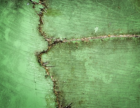 background or texture a crack in the green surfaceの写真素材