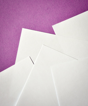 abstract White paper leaflets on a purple backgroundの写真素材