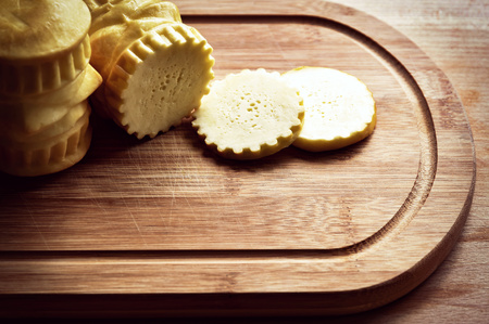 traditional smoked cheese oscypek on a boardの写真素材