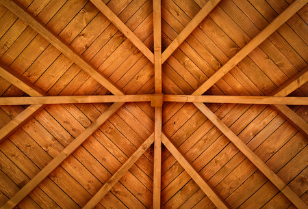 background or texture of a wooden cross with beams of the roofの写真素材