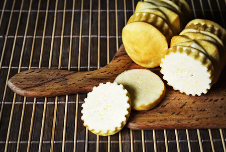 background of traditional sheep cheese on a kitchen counter topの写真素材