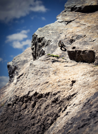 Dreamy background Anchor climbing on a rock wallの写真素材