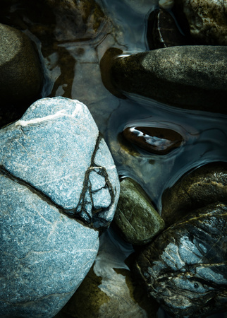 abstract background Round rocks in waterの写真素材