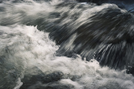 abstract background or texture details waves on the wild river
