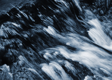 abstract nature background Dark wild river with blurred ripples