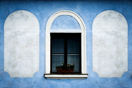 retro background window on the blue old wallの写真素材