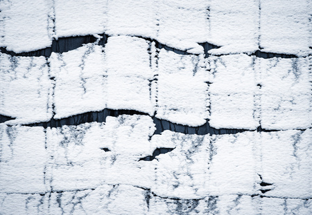 abstract winter background Wave on the snow cover on the roofの写真素材