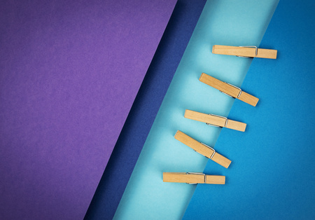 abstract background composition of colored papers and clothes pinsの写真素材