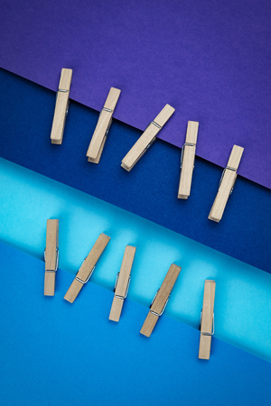 abstract background wooden pins attached to blue paperの写真素材